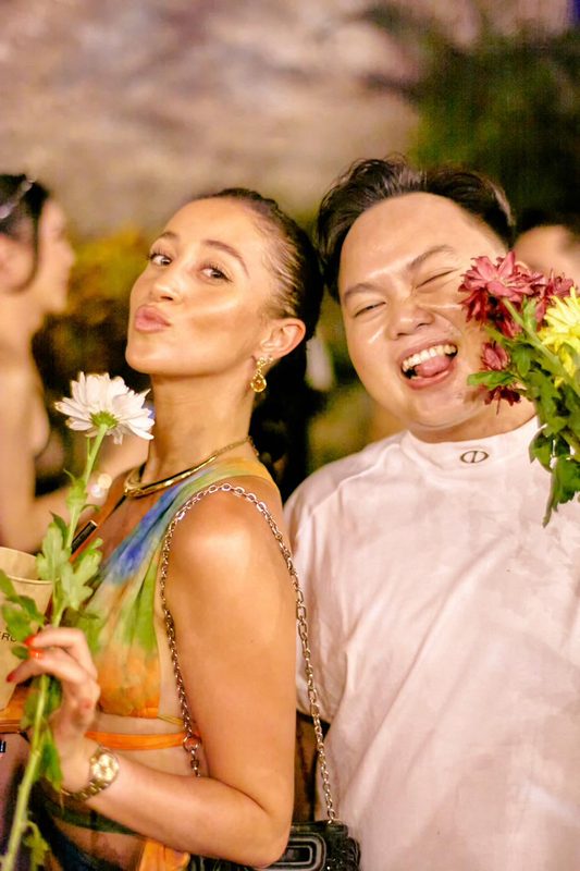 Festival guest with flowers at Day Zero Bali