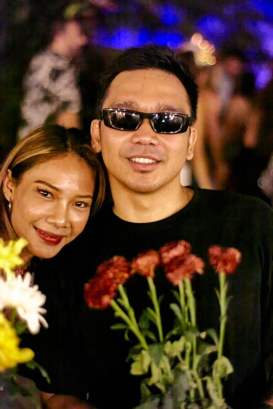 Festival guest with flowers at Day Zero Bali