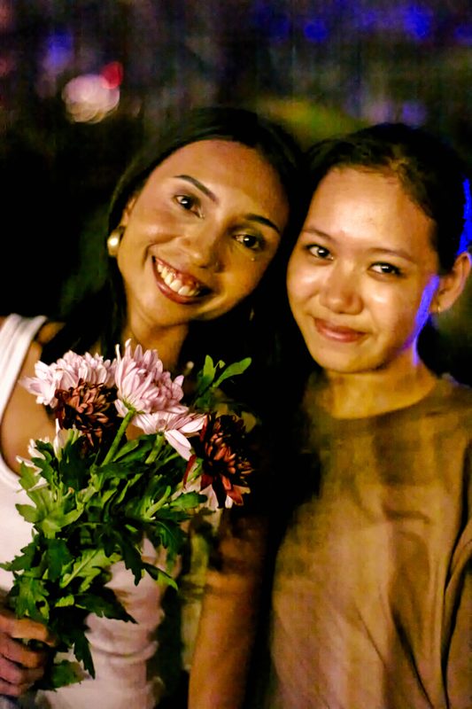 Festival guest with flowers at Day Zero Bali