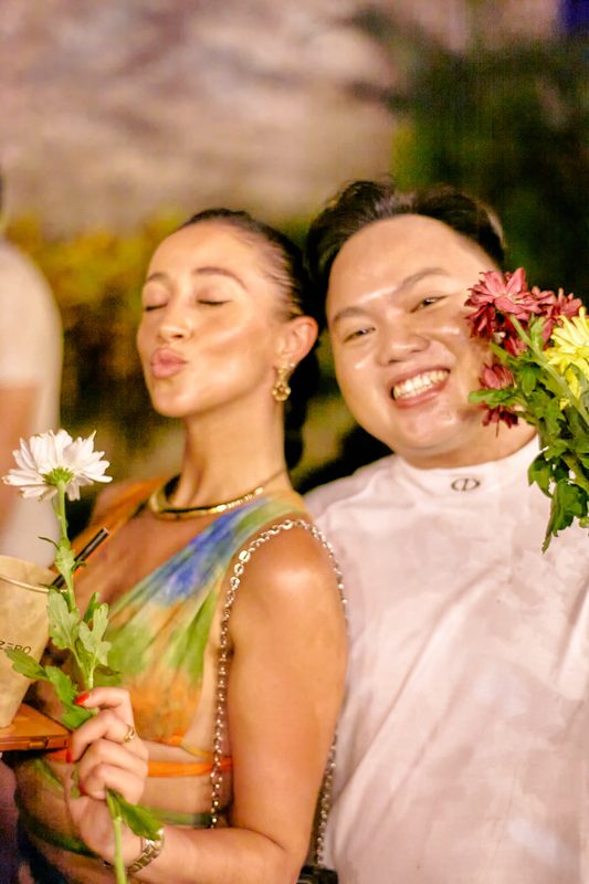 Festival guest with flowers at Day Zero Bali