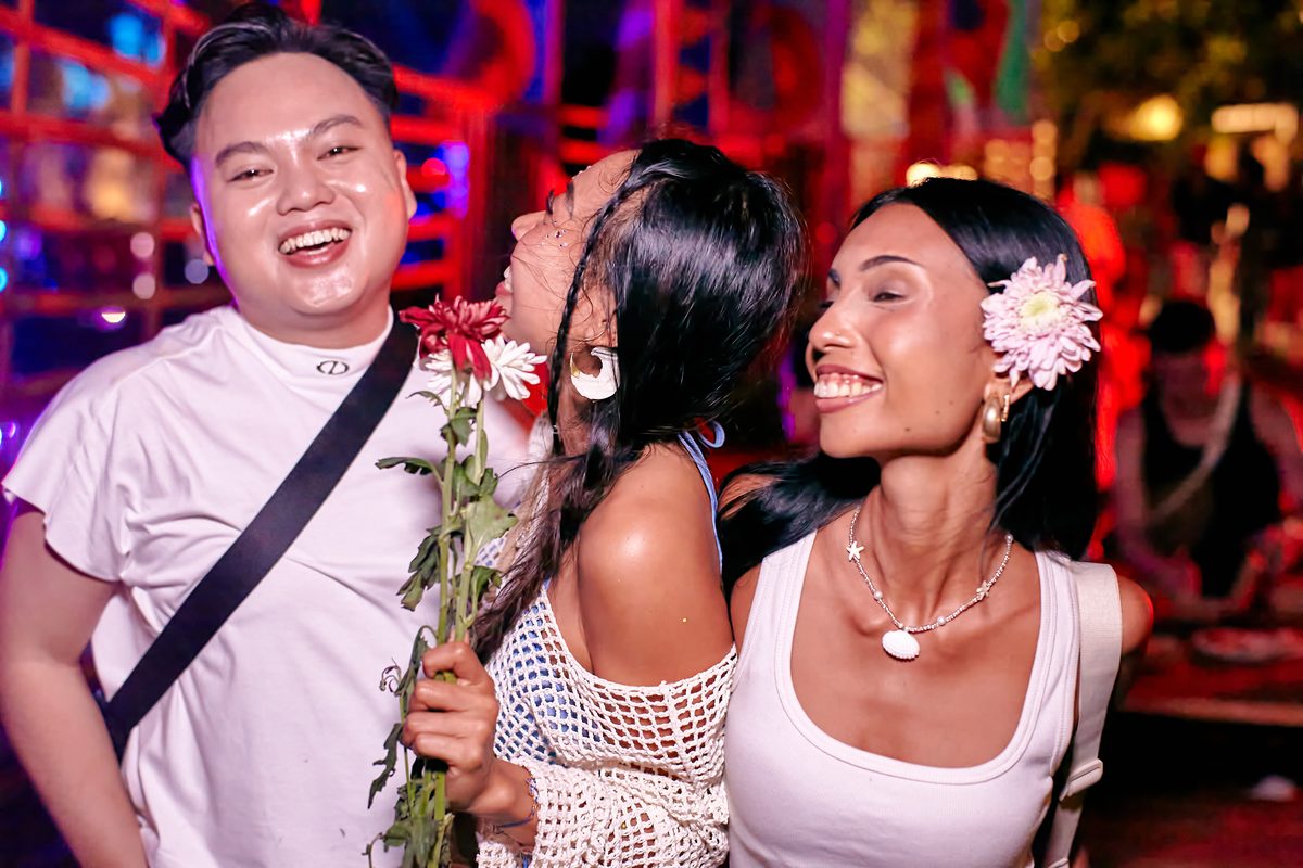 Festival guest with flowers at Day Zero Bali