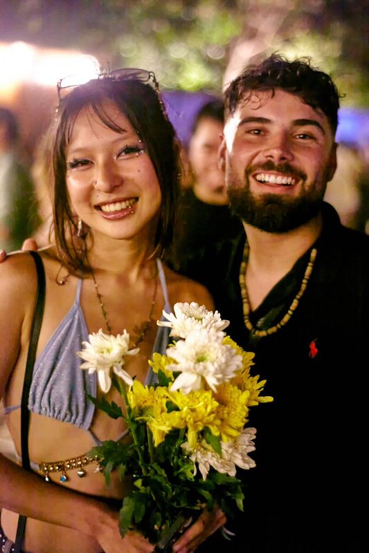 Festival guest with flowers at Day Zero Bali