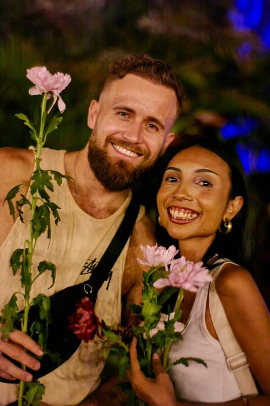 Festival guest with flowers at Day Zero Bali