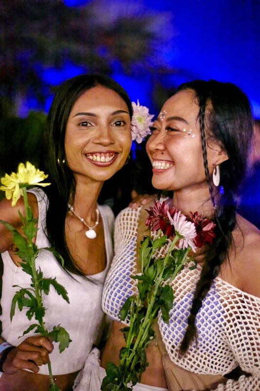 Festival guest with flowers at Day Zero Bali