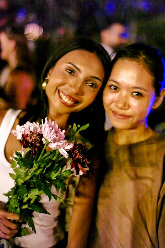 Festival guest with flowers at Day Zero Bali