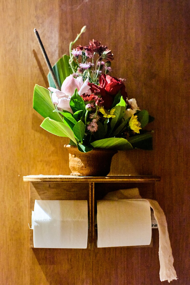 Fresh flowers and toilet paper inside Ecoranah unit
