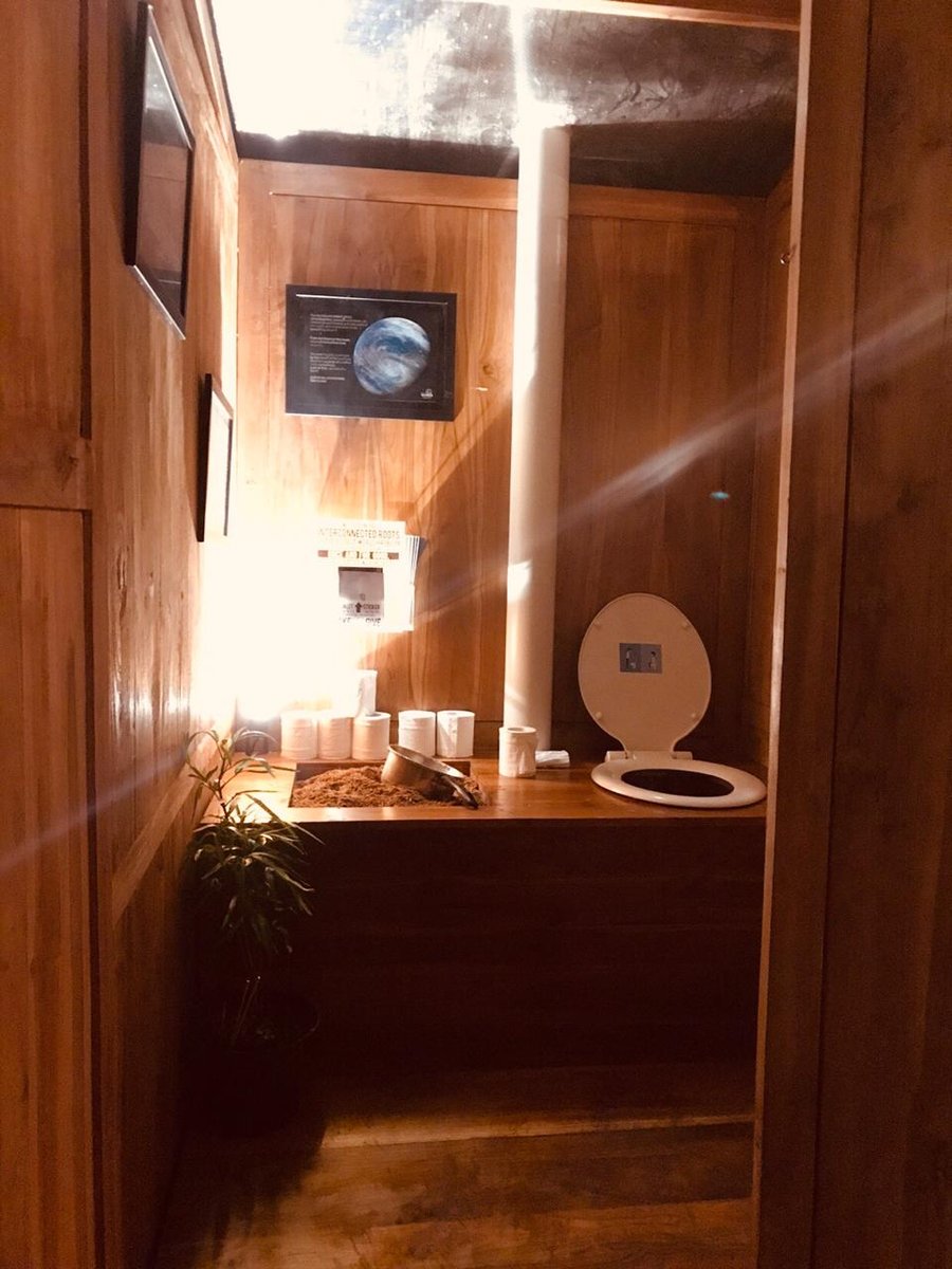 Full interior view of teak Ecoranah composting toilet