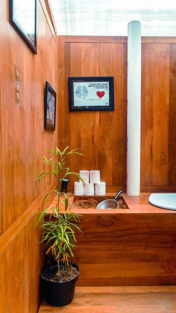 Inside an Ecoranah teak composting toilet — sawdust system